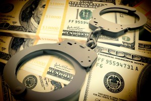 Handcuffs-on-Money-960x645